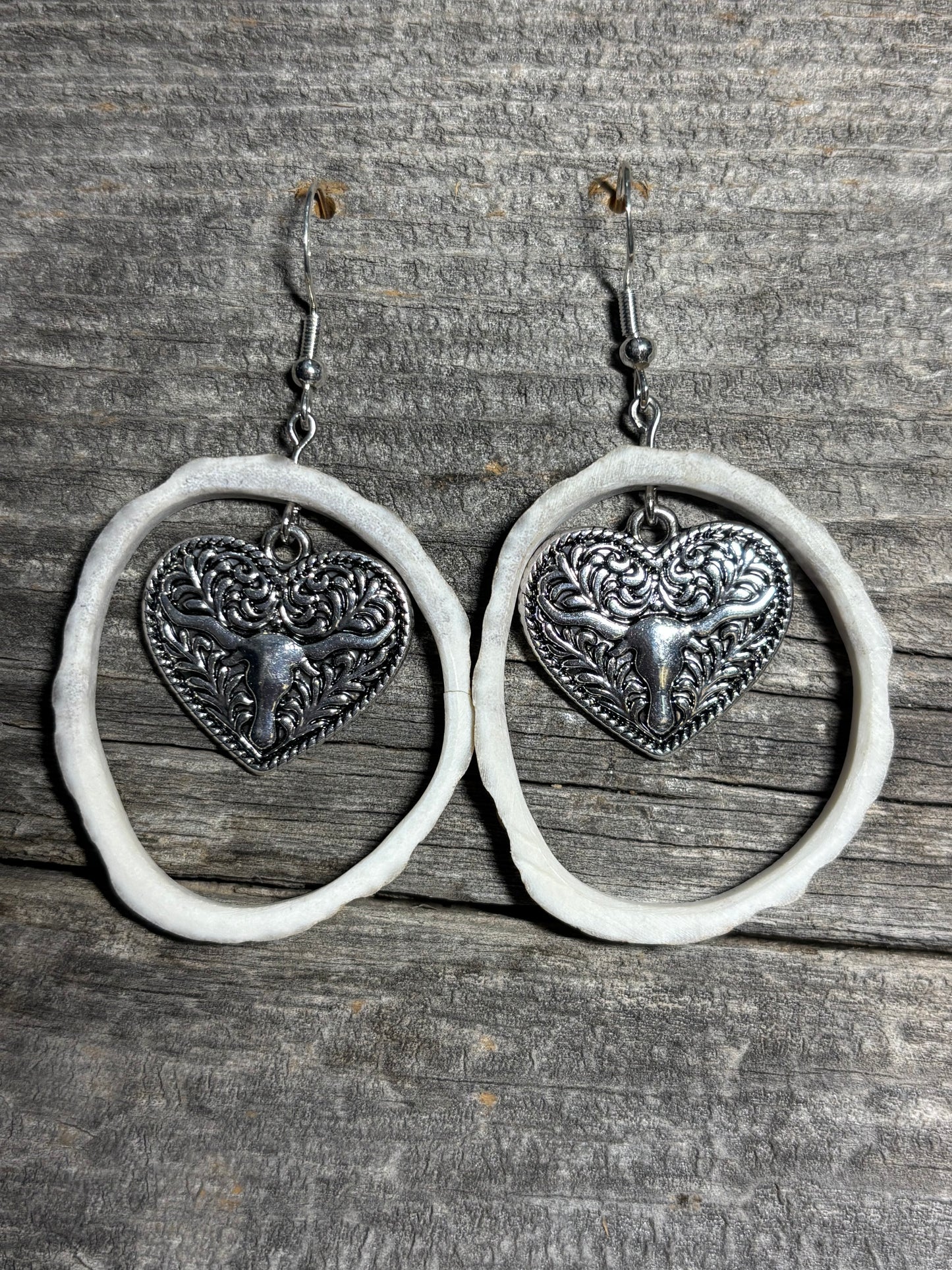 Silver heart with steer head design